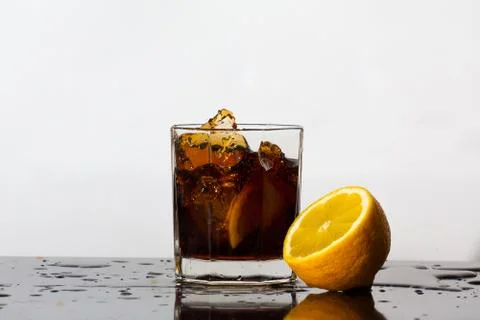 Splashing drink of cola Stock Photos
