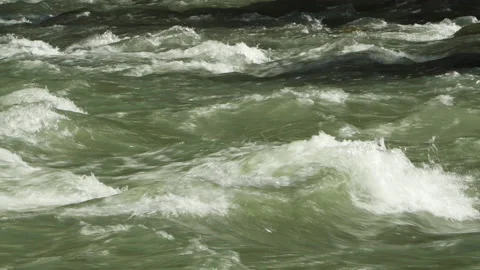 Splashing foam in a fast flowing mountain river Stock Footage 214563377