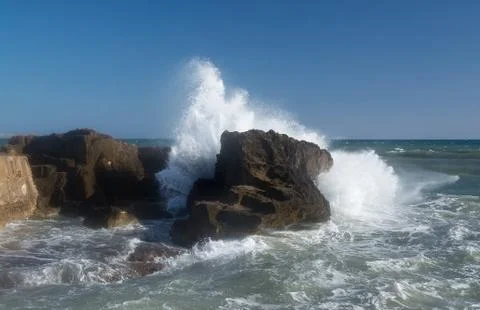 Splashing foaming wave Stock Photos