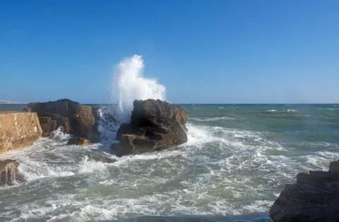 Splashing foaming wave Stock Photos
