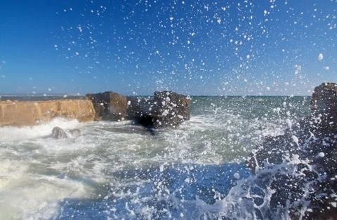 Splashing foaming wave Stock Photos