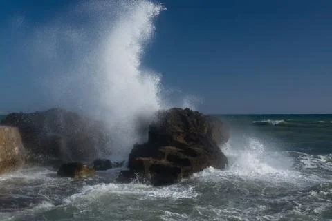 Splashing foaming wave Stock Photos