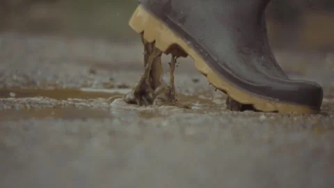 Splashing joyfully through rainy puddles while showcasing my stylish and Video stock 313283689
