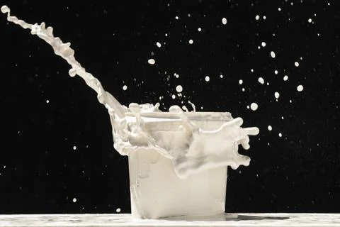 Splashing paint from a can Stock Photos