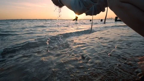 Splashing sea waves at sunset, romantic mood, slow motion Stock Footage 76889162