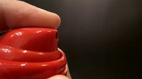 The splashing spray from the bottle closeup on dark background Stock-Footage 73873495