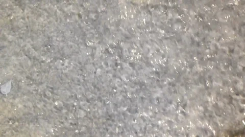 Splashing spring water cascading across rocks Video stock 38356871