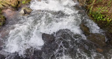 Splashing water flowing in the river Stock Footage 170380389