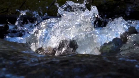 Splashing water in a mountain stream Stock Footage 120435934
