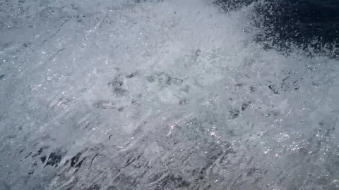 Splashing water on sea from the moving boat Stock Footage 114343738