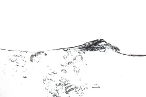 Splashing water surface with a white background Stock Photos
