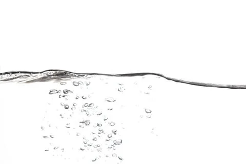 Splashing water surface with a white background Stock Photos