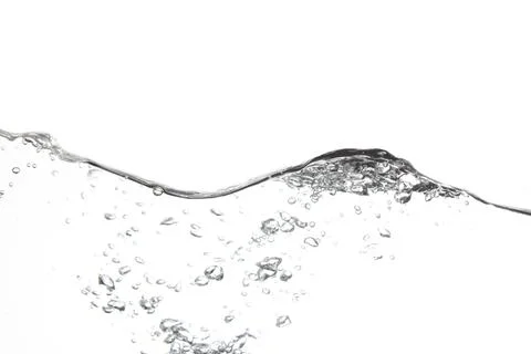 Splashing water surface with a white background Stock Photos