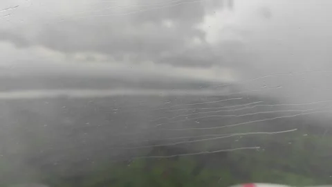 Splashing water on window plane Stock Footage 268106487