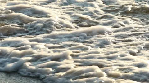 Splashing waves on the beach Stock Footage 10573848
