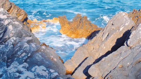 Splashing waves onto rocky coast Stock-Footage 146627993