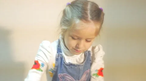 A Splendid Clay Craft is Made by a Little Girl, Dressed in Blue Apron and White Stock Footage 59123226