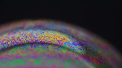 Splendid effects that are created on the surface of the illuminated soap bubbles Video stock 240111700