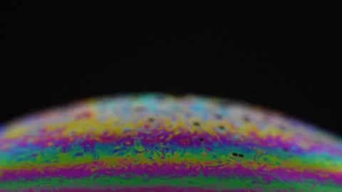 Splendid effects that are created on the surface of the illuminated soap bubbles Video stock 240111708