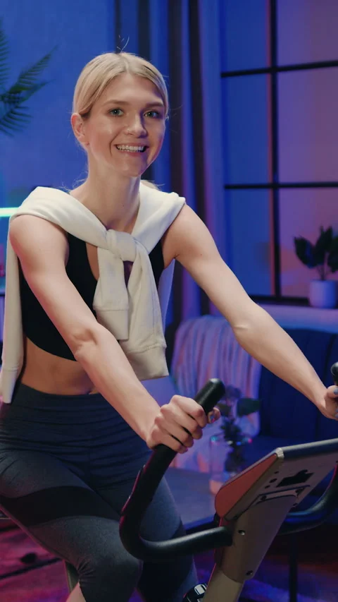 Splendid joyful fit athletic slender 25-aged blonde in training clothes exercisi Stock Footage 328935447