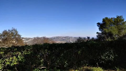 A splendid panoramic view shows the profile of Mount Etna standing out agai.. Stock Photos