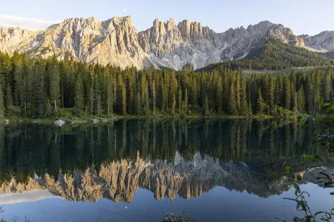 Splendid view of Lake Carezza. The forest are perfectly reflected. Stock Photos