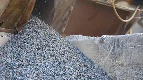 Splinters belt is rolling and dropping off gravels on the heap of rocks Stock Footage 74949881