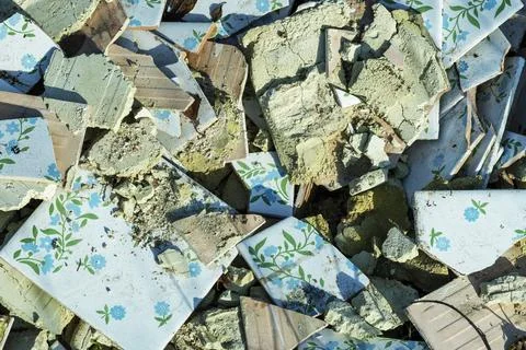 Splinters of a ceramic tile . Texture white pieces, shards against a dark b.. Stock Photos