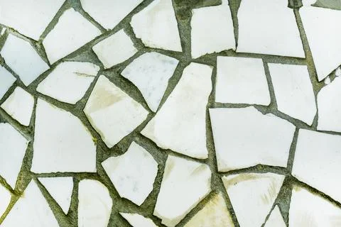 Splinters of a white ceramic tile . Texture white pieces, shards against a .. Stock Photos