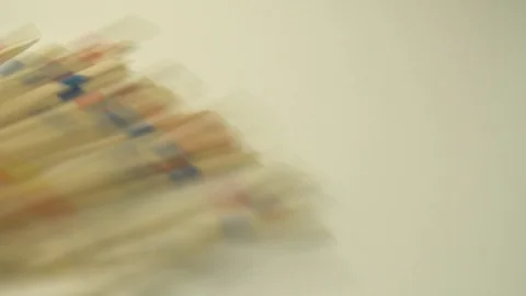 Splints of the micado game fall on a white shelf Stock Footage 127051892