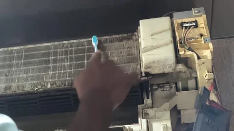 Split AC filter cleaning process by skilled technician Stock Footage 334193965