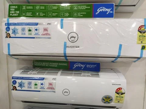 The split air conditioners attached on the wall. Stock Photos