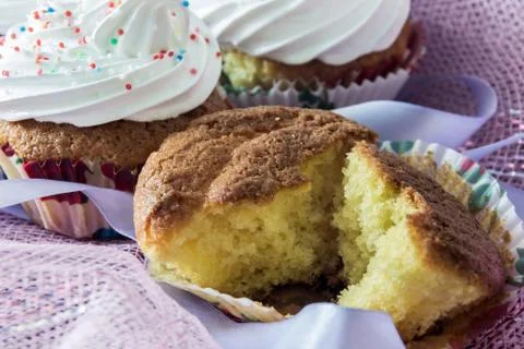 Split biscuit muffin on background of a delicious muffins with protein cream Foto stock