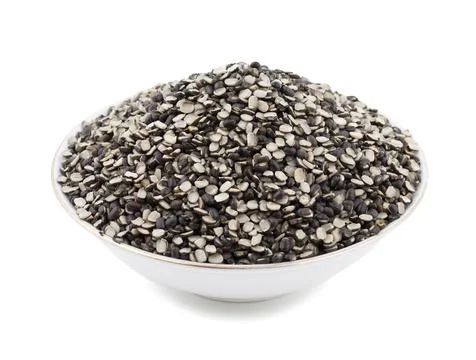 Split Black Lentil on White Background Stock Photos