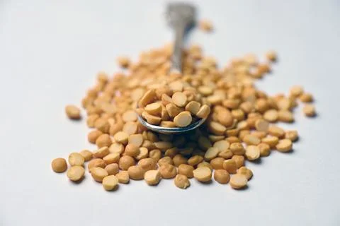 Split Chana Dal Angled Top View Texture on White Defocus Background Macro P.. Stock Photos