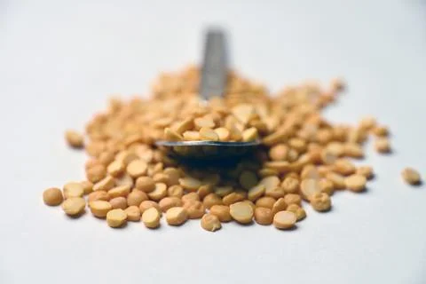 Split Chana Dal Angled Top View Texture on White Defocus Background Macro P.. Stock Photos