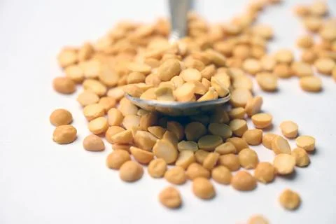 Split Chana Dal Angled Top View Texture on White Defocus Background Macro P.. Stock Photos