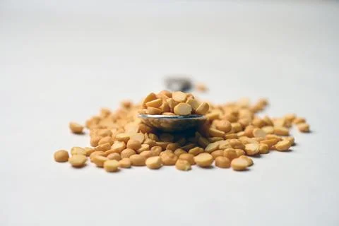 Split Chana Dal Angled Top View Texture on White Defocus Background Macro P.. Stock Photos