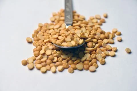 Split Chana Dal Angled Top View Texture on White Defocus Background Macro P.. Stock Photos