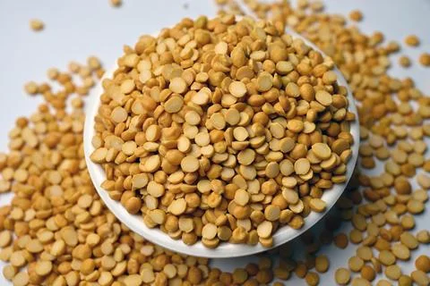 Split Chana Dal in Bowl Angled Top View with Defocus Background Macro Photo.. Stock-Fotos
