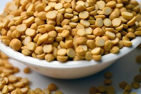 Split Chana Dal in Bowl Angled Top View with Defocus Background Macro Photo.. 스톡 사진
