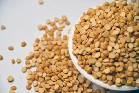 Split Chana Dal in Bowl Angled Top View with Defocus Background Macro Photo.. Stock Photos