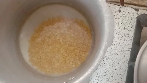 Split Chickpeas Soaking in Water in a Bowl Stock-Footage 347441649