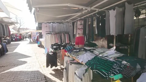 Split Clothes Market Walk with Crowds in Sunshine Stock Footage 332121880