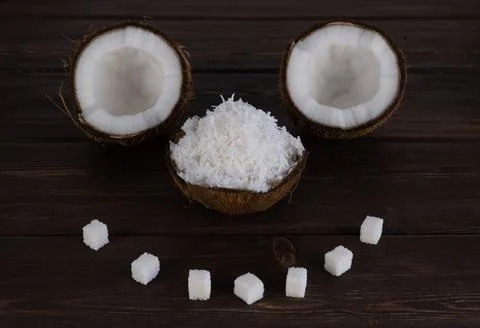 Split coconut on wooden planks. selective focus. Foto stock