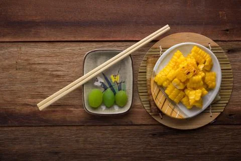 Split corn on wood background Stock Photos