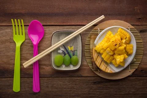 Split corn on wood background Stock-Fotos