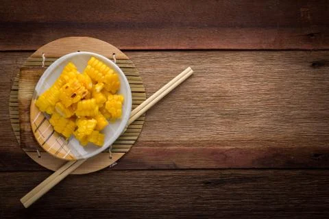 Split corn on wood background Stock Photos