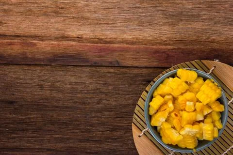 Split corn on wood background Foto stock