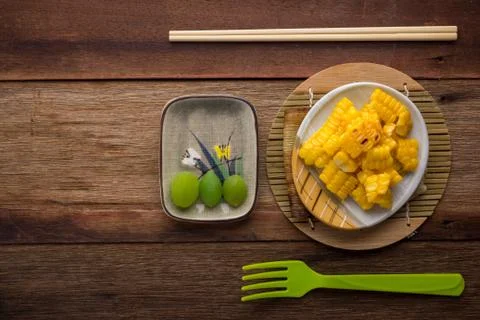 Split corn on wood background Stock Photos